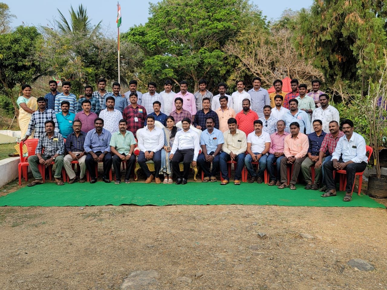 The Manihamsa team, around forty people, gathered for a group photograph outdoors